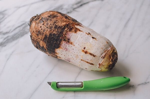 peeling large taro