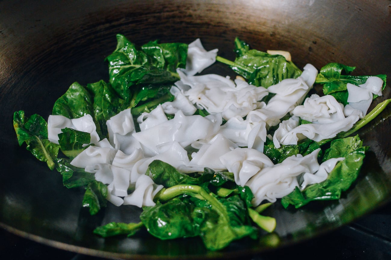 Noodles and Chinese broccoli in wok