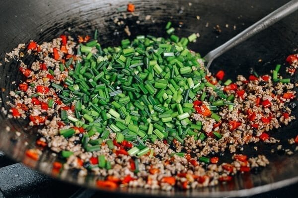 Garlic Chives with Pork, by thewoksoflife.com
