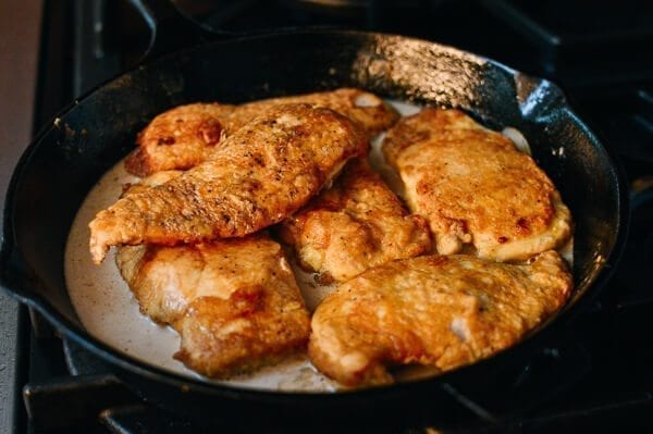 Adding chicken to chicken francese sauce, by thewoksoflife.com