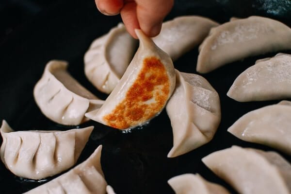 Bottom of dumpling golden brown, thewoksoflife.com