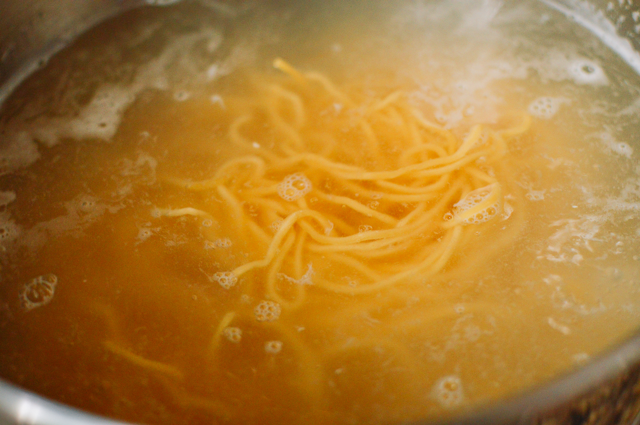 Chinese egg noodles in boiling water