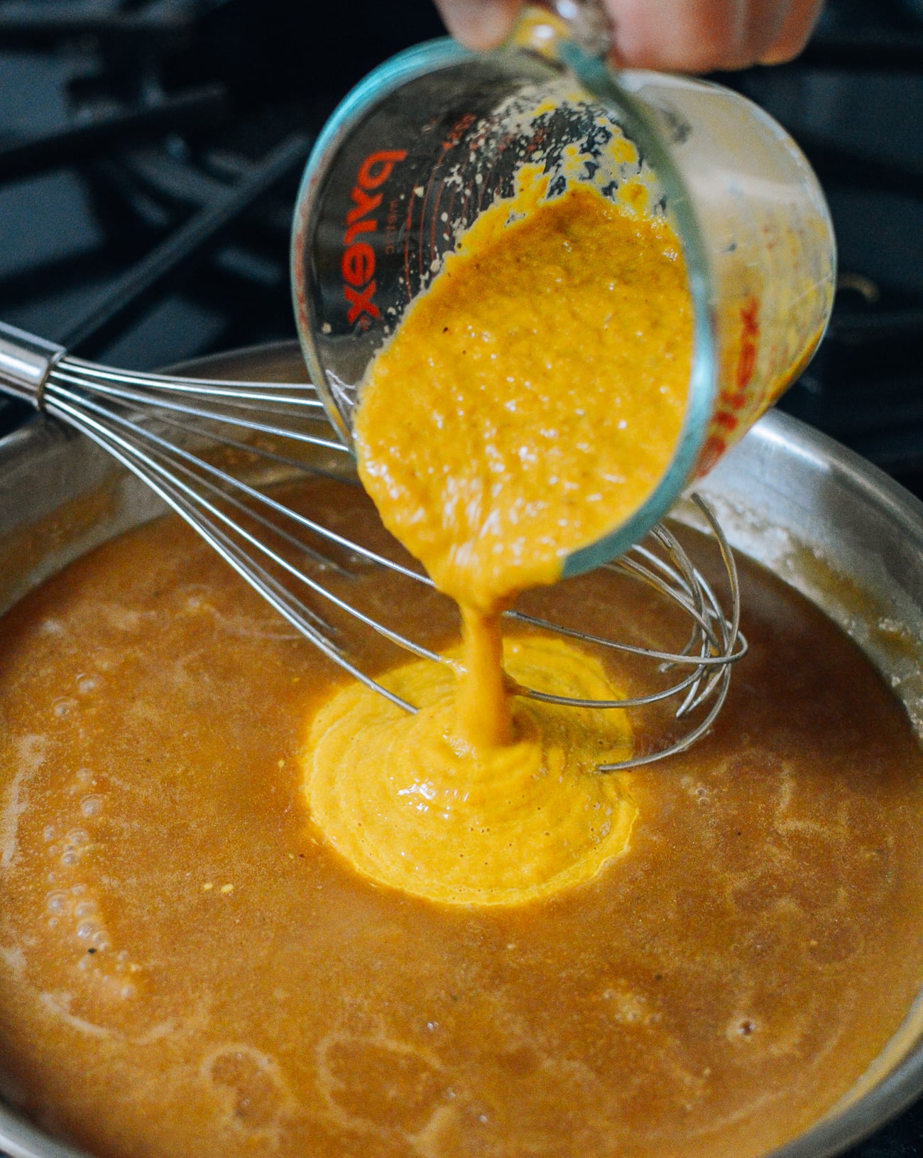 stirring vegetable and giblet puree into gravy