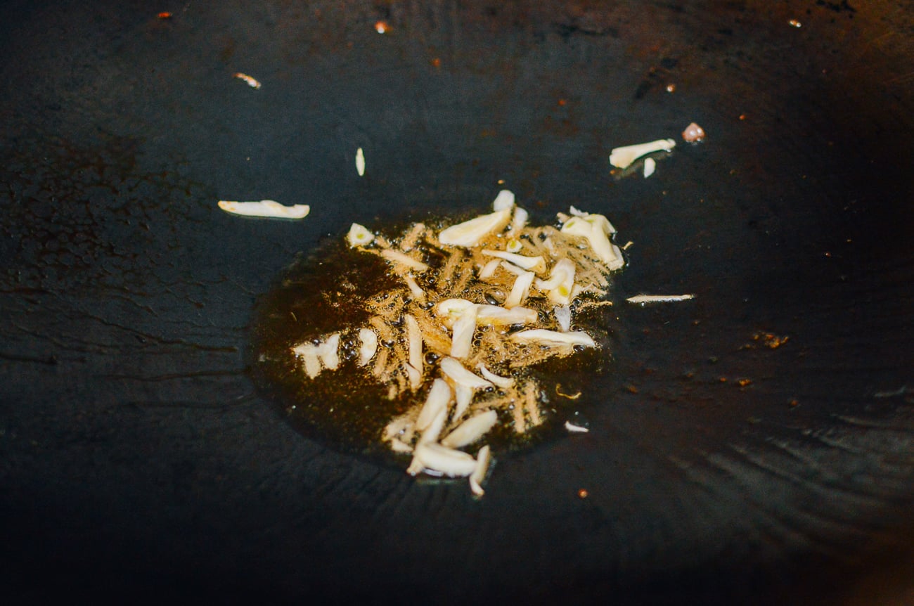 ginger and garlic in wok with oil
