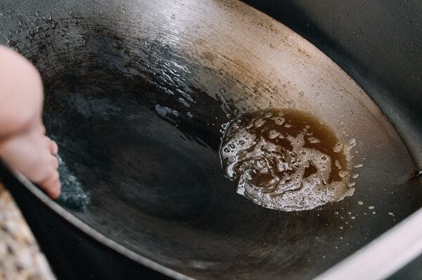 scrubbing residue off of wok