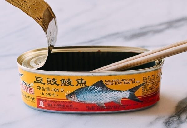 chopsticks in open can of fried dace
