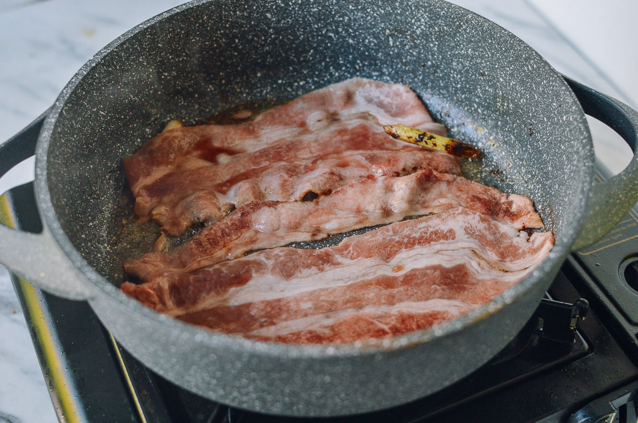 cooking thinly sliced beef in pan