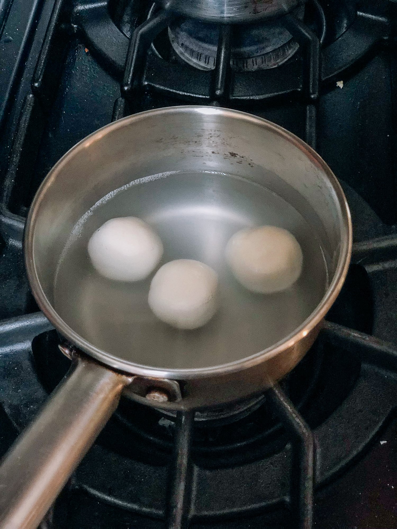 cooking rice dough ball=s in water for Savory Tang Yuan, by thewoksoflife.com