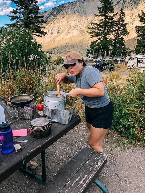 Kaitlin cooking at campground, thewoksoflife.com