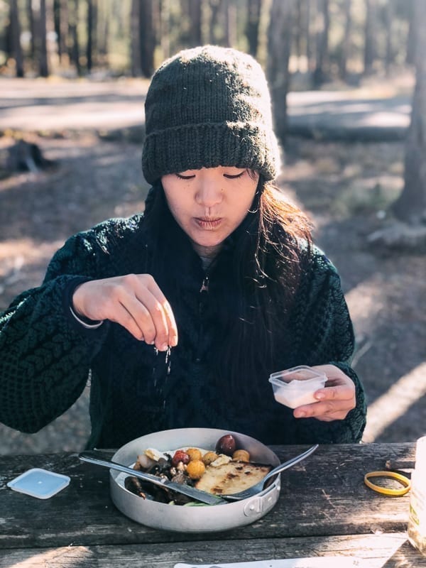 Sprinkling salt on camp breakfast