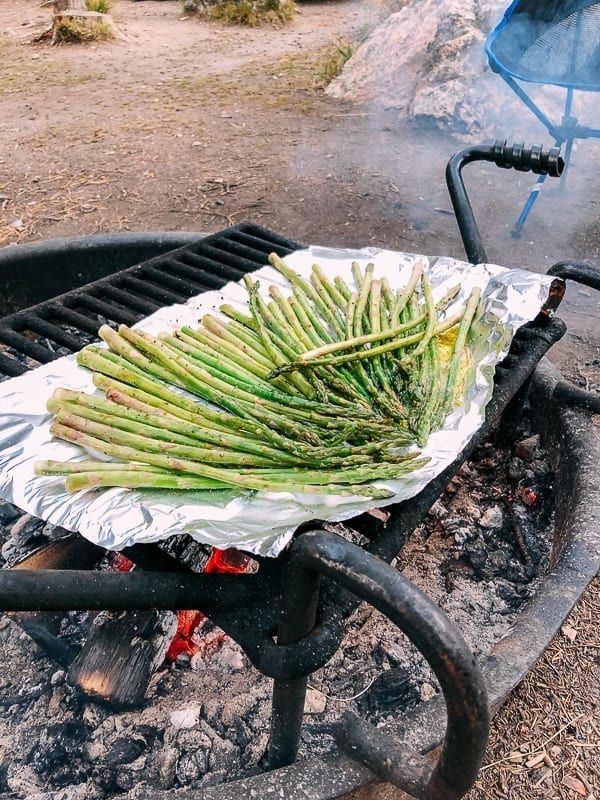 Grilling asparagus over campfire, thewoksoflife.com