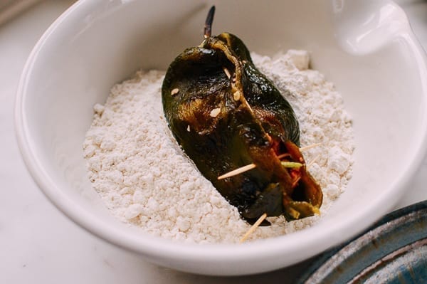 Dredging peppers in flour, thewoksoflife.com