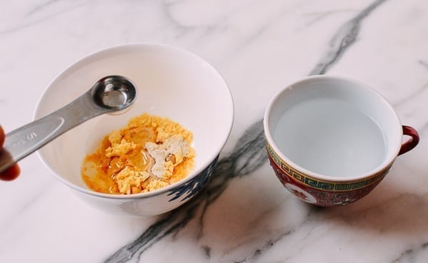 Adding water to the mustard dry ingredients, thewoksoflife.com