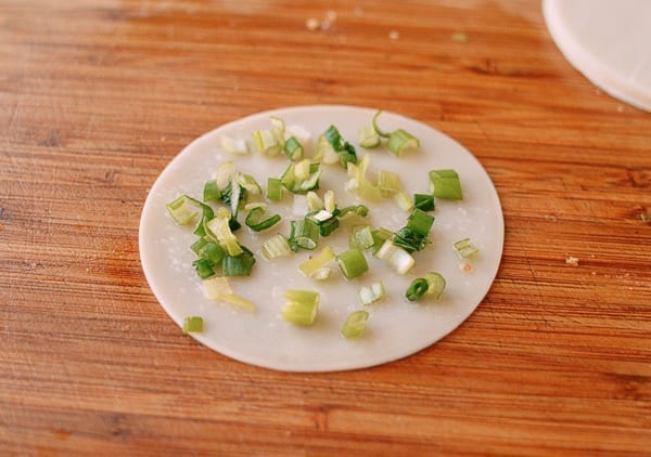 Scallions on dumpling wrapper with oil and salt, thewoksoflife.com