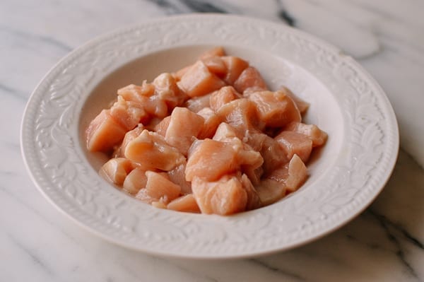 Marinating chicken for kung pao chicken, thewoksoflife.com