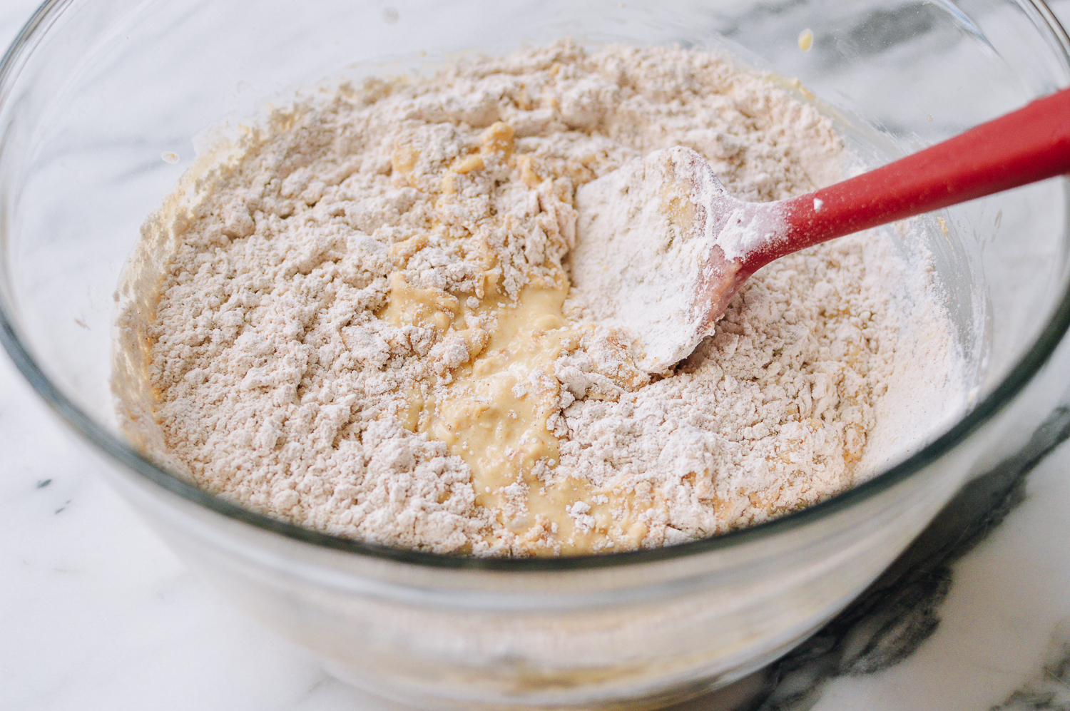 Folding dry ingredients into wet ingredients, thewoksoflife.com