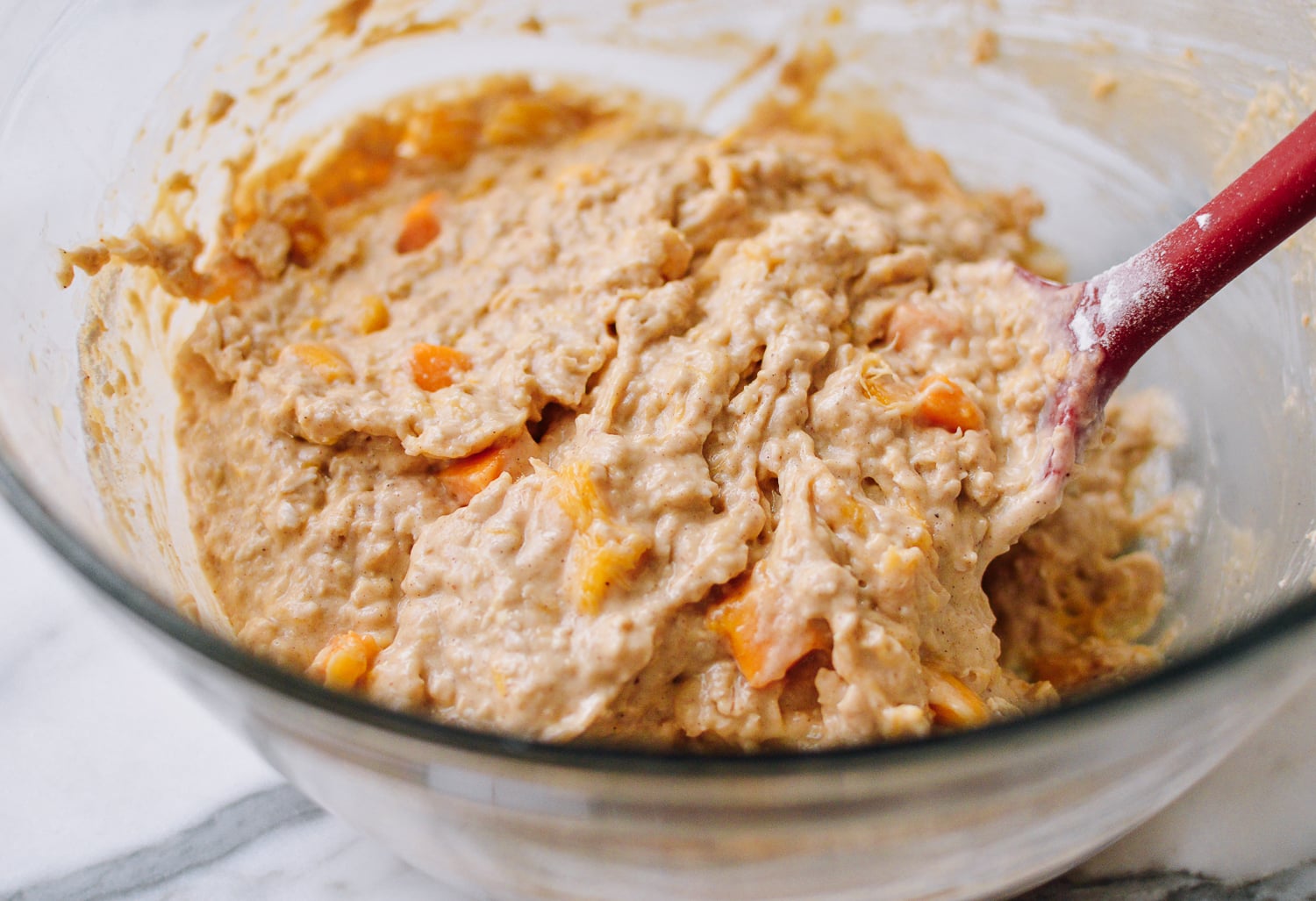 Folding cubed mango into batter, thewoksoflife.com