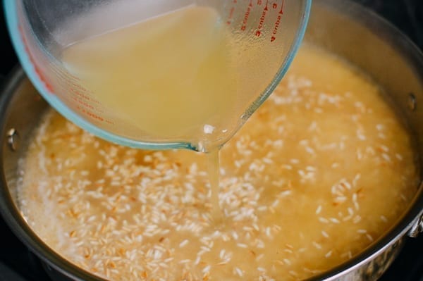 Adding Chicken Stock to Rice, thewoksoflife.com