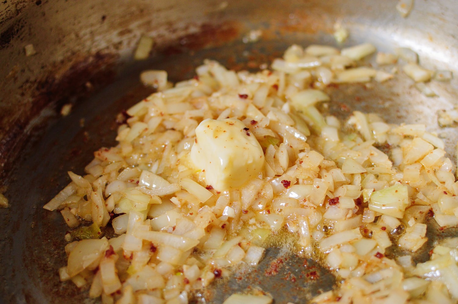 Butter and onions in pan, thewoksoflife.com