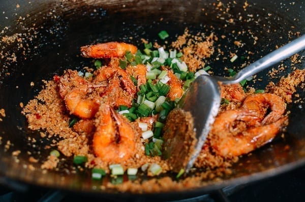 Adding the scallions to shrimp, thewoksoflife.com