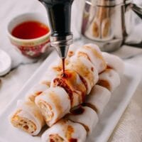 Drizzling sauce over zhaliang, thewoksoflife.com