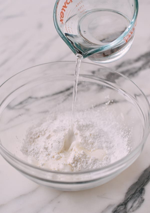 Adding water to rice flour and starch mixture, thewoksoflife.com