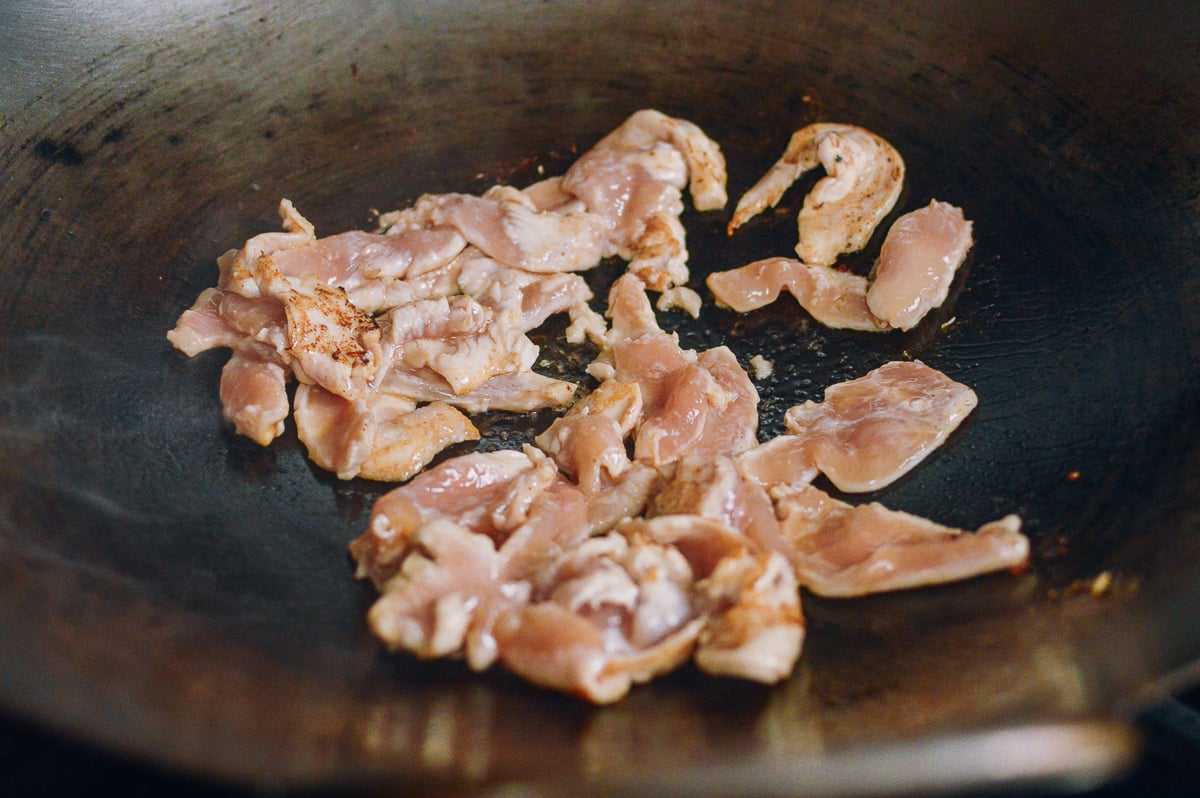 Searing chicken in wok, thewoksoflife.com