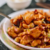 Scoop of kung pao chicken in spoon