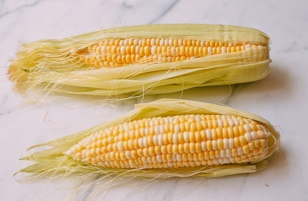 Two ears of bi-color sweet corn, thewoksoflife.com