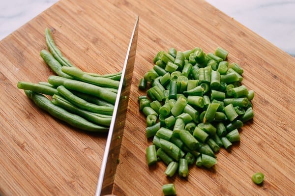 Chopping green beans, thewoksoflife.com