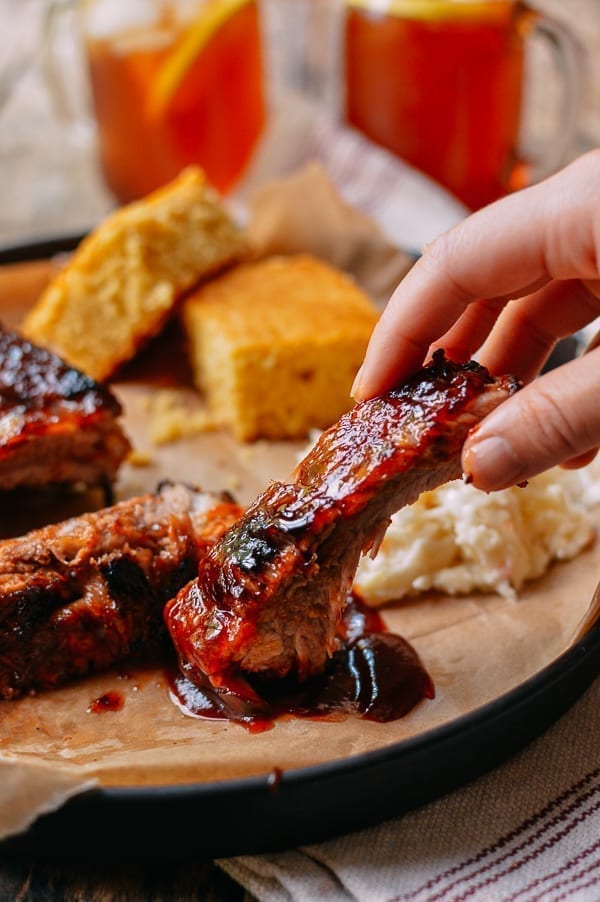 Dipping rib in bbq sauce, thewoksoflife.com