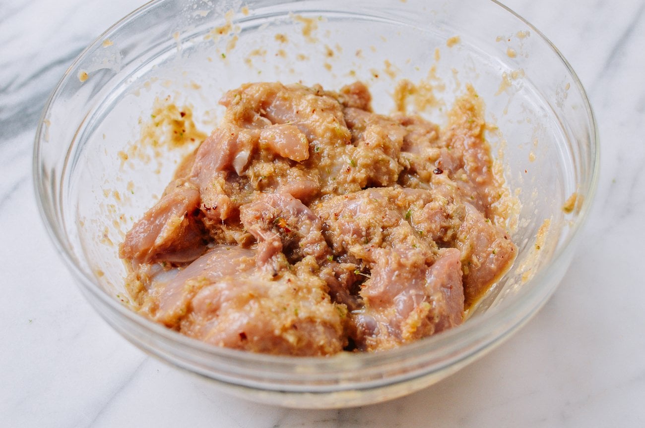 boneless chicken thighs with lemongrass marinade in glass bowl