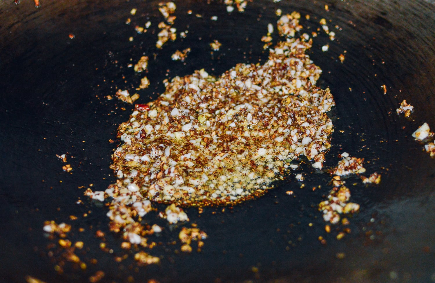 Frying sichuan peppercorns, ginger, and garlic, thewoksoflife.com