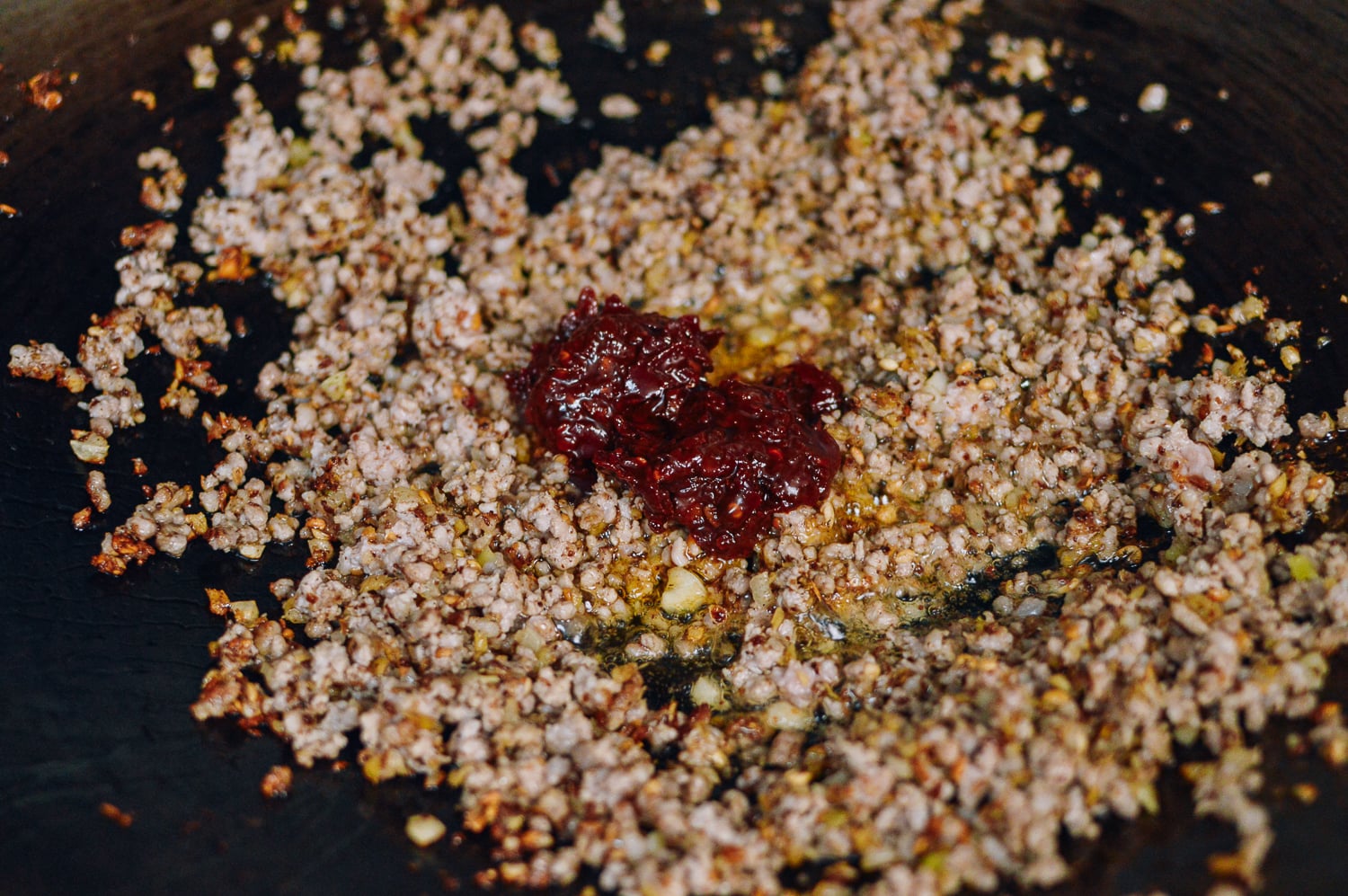 Adding Spicy Bean Sauce to Ground Pork, thewoksoflife.com