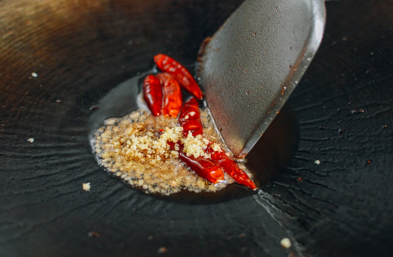ginger and dried chili peppers in wok