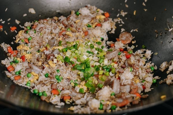 Adding scallions to fried rice, thewoksoflife.com