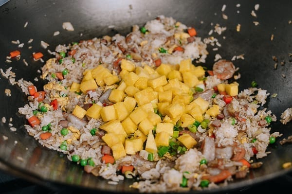 Adding pineapple to fried rice, thewoksoflife.com