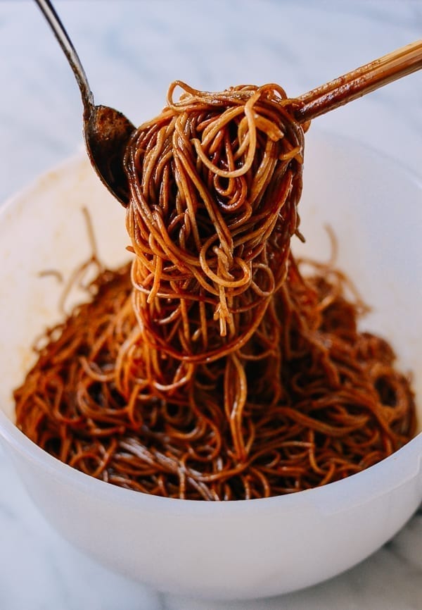 Tossing noodles with sauce, thewoksoflife.com