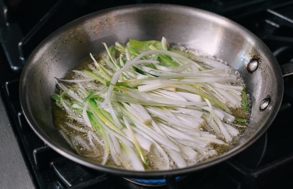 Frying scallions in oil, thewoksoflife.com