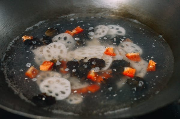 Blanching lotus root, wood ears, and red bell peppers, thewoksoflife.com