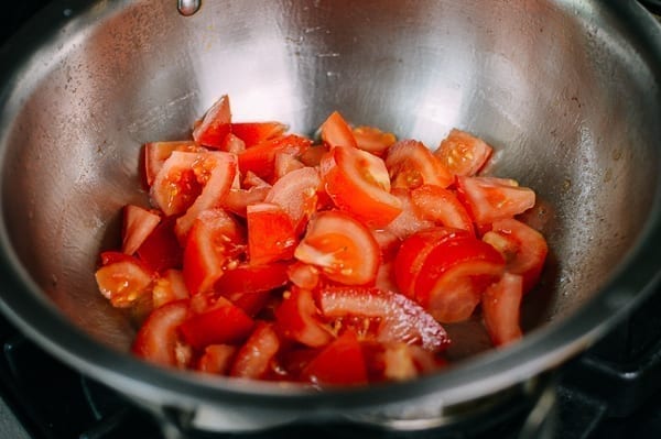 Tomatoes in soup pot, thewoksoflife.com
