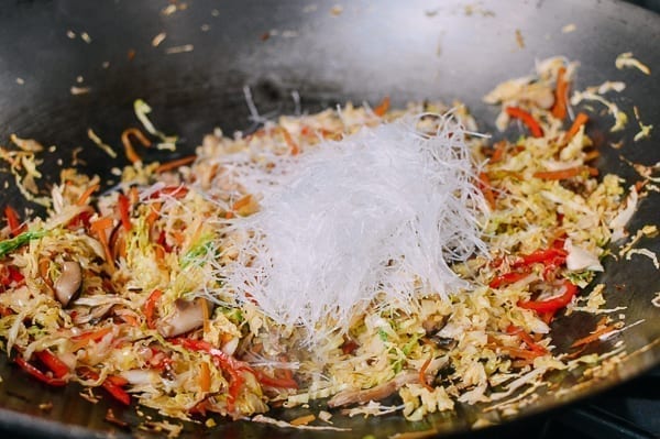 Adding glass noodles to egg roll filling, thewoksoflife.com