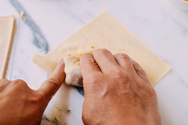 Wrapping veggie egg rolls, thewoksoflife.com