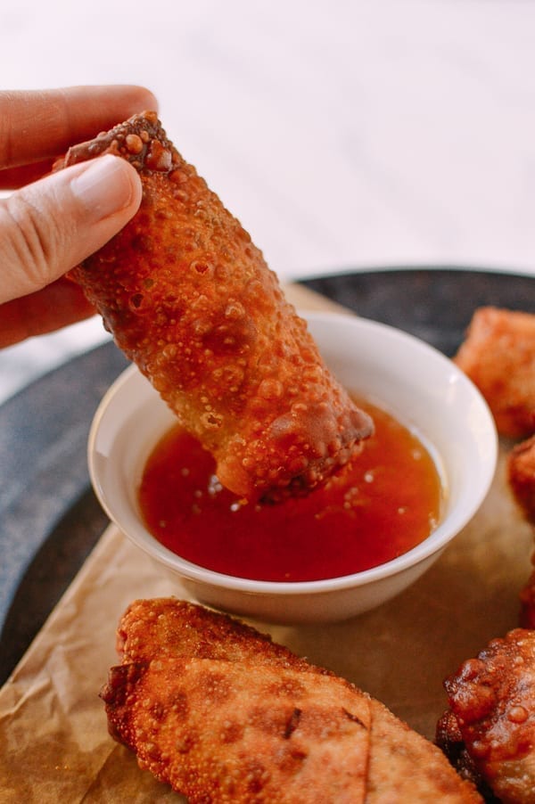 Dipping egg roll into duck sauce, thewoksoflife.com