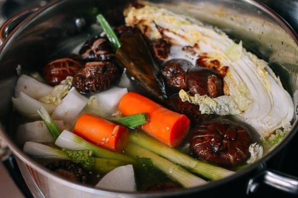 Vegetables in stock pot with water, thewoksoflife.com