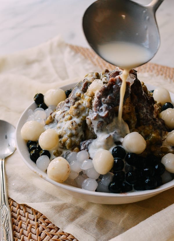 Pouring condensed milk over the top, thewoksoflife.com
