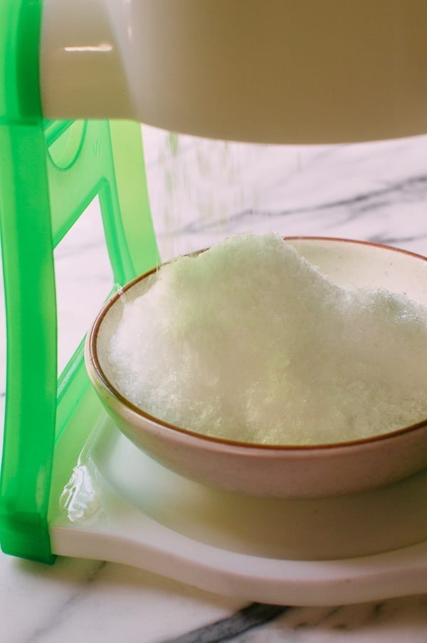 Shaving Ice with manual ice shaving machine, thewoksoflife.com