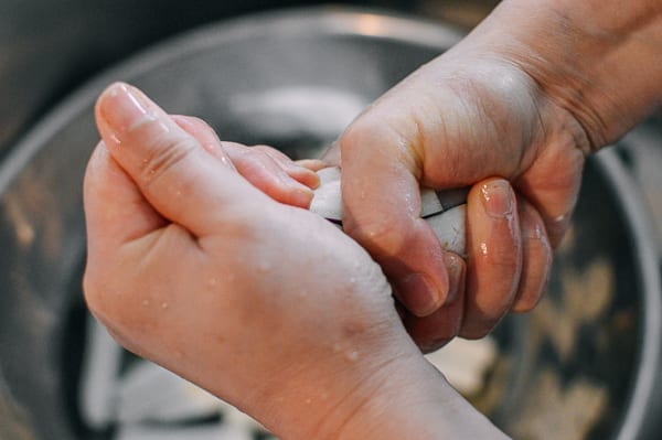 Squeezing liquid out of soaked eggplant, thewoksoflife.com