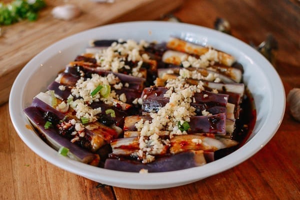 Adding garlic over steamed eggplant, thewoksoflife.com