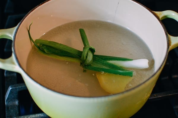 Water with ginger and scallion for poaching, thewoksoflife.com